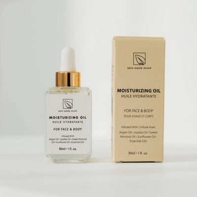 Moisturizing oil bottle with dropper and packaging on a white background