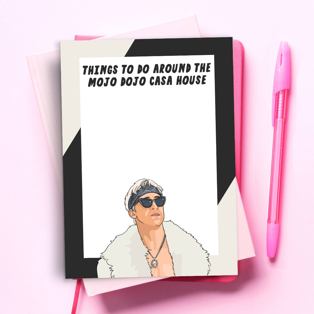Greeting card with a cartoon character and text 'Things to do around the Mojo Dojo Casa House' on a pink background.