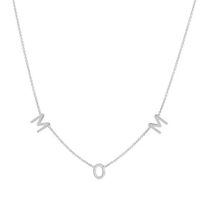A delicate sterling silver necklace spelling out 'MOM' with individual letter charms evenly spaced along a fine chain, displayed on a white background. This heartfelt necklace is available in Ottawa, Ontario, Canada