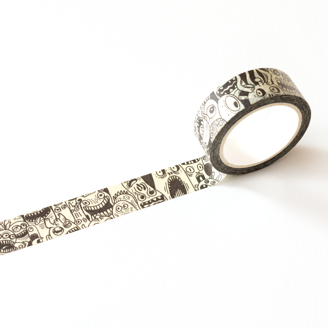 Roll of decorative tape with a black and white pattern on a white background