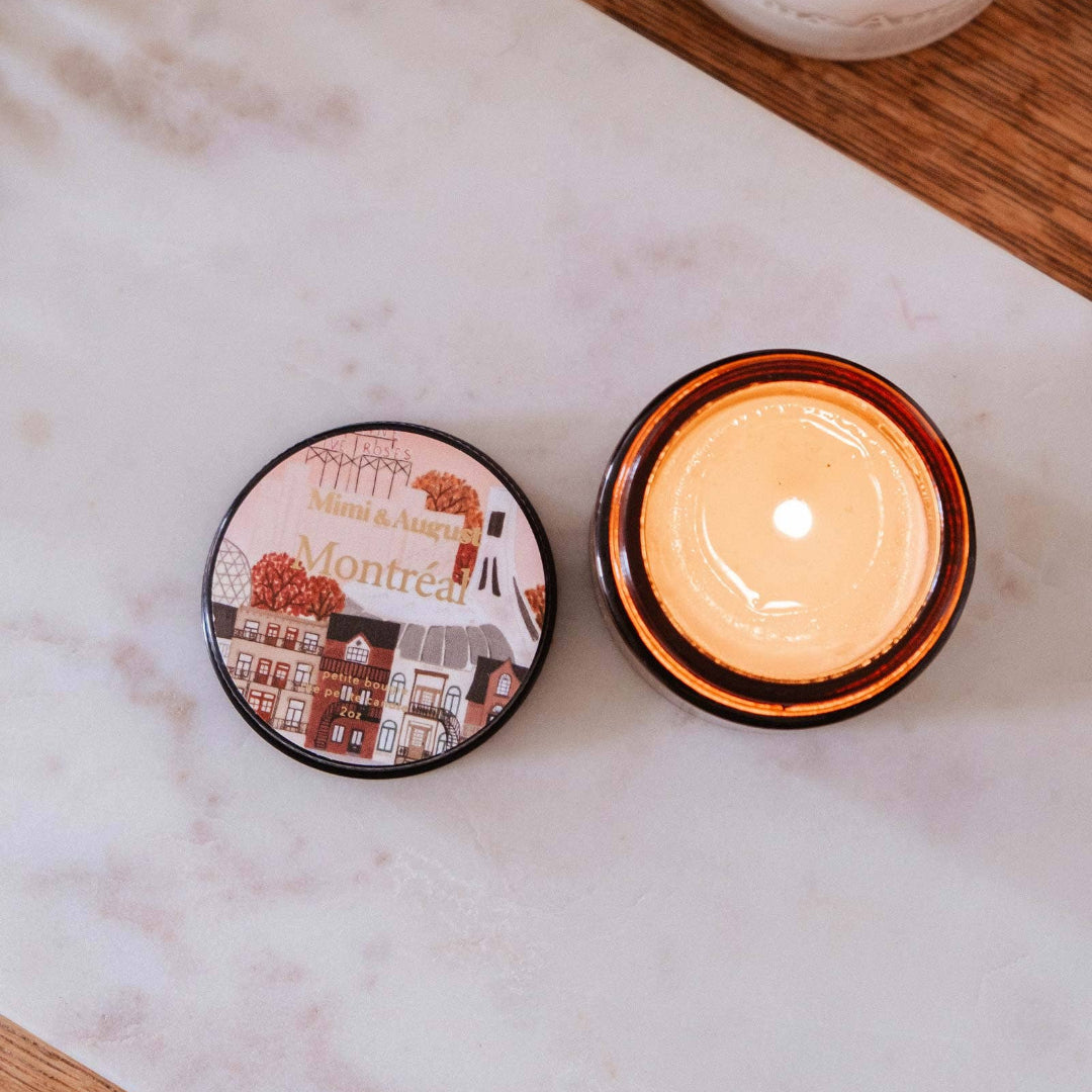 Candle with decorative packaging on a marble surface