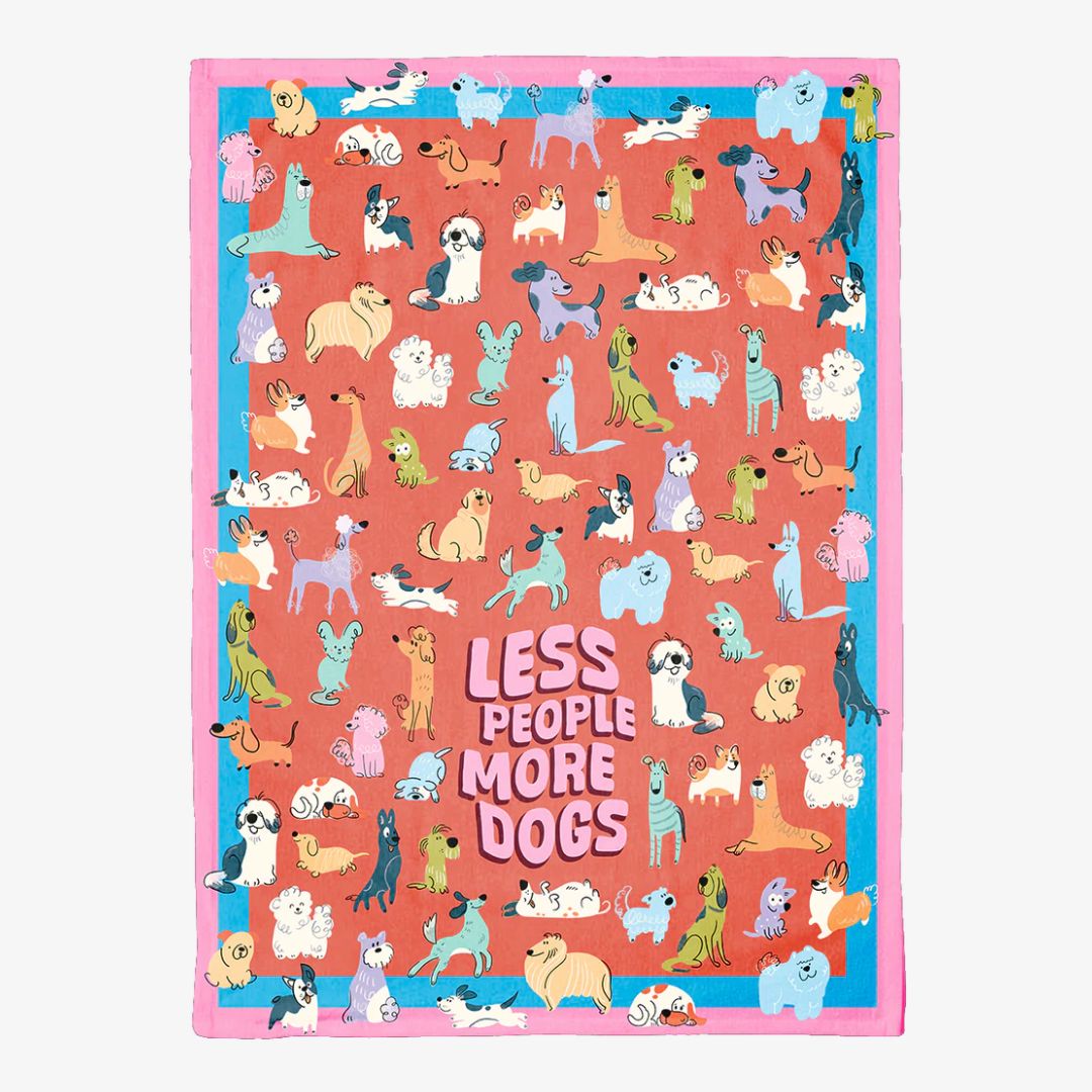 Colorful dish towel with dog pattern and 'Less People More Dogs' text on a white background