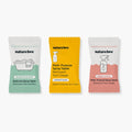 Three Nature Bee multi-purpose spray tablets in individual foil packs, shown side-by-side on a light gray background. The left pack is white with a mint green lower section labeled Eucalyptus Mint.