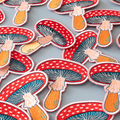 Pattern of colorful mushroom illustrations on a gray background