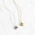 Two necklaces with pendants on a white background