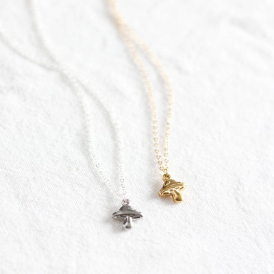 Two necklaces with pendants on a white background