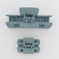 Two gray hair clamps on a white background