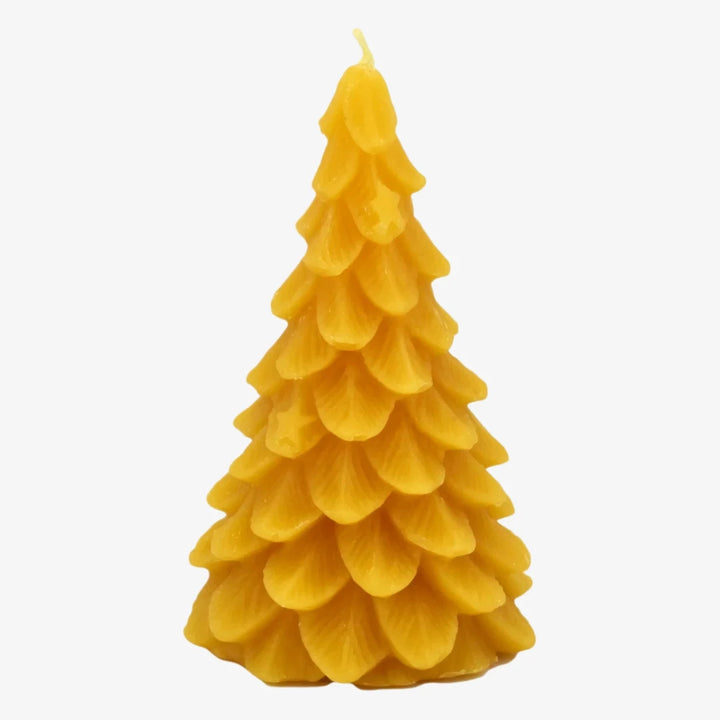 A yellow, beeswax candle shaped like a Christmas tree. The candle has detailed branches and a pointed top.