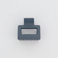 Gray plastic clip on a white background