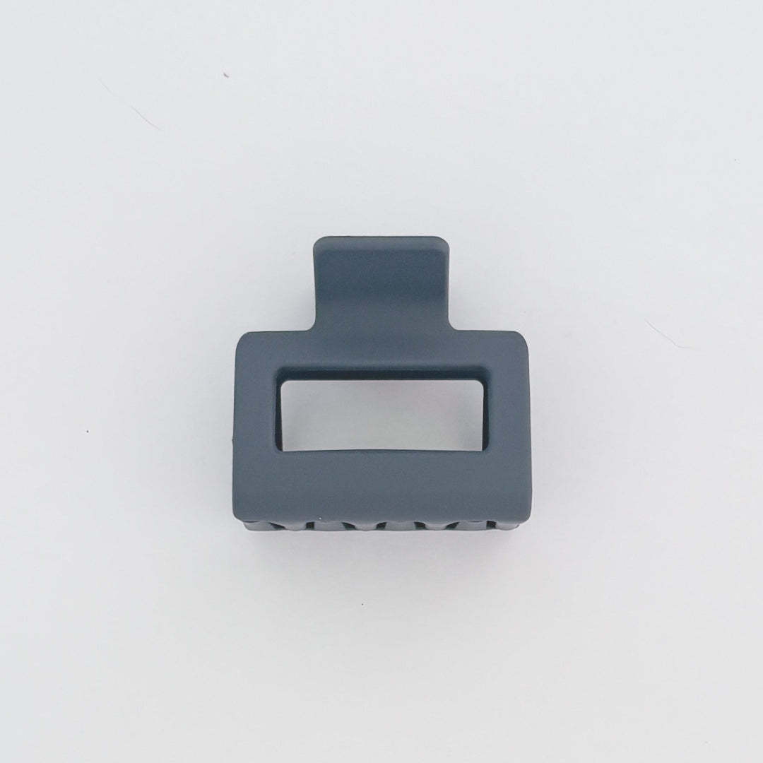 Gray plastic clip on a white background
