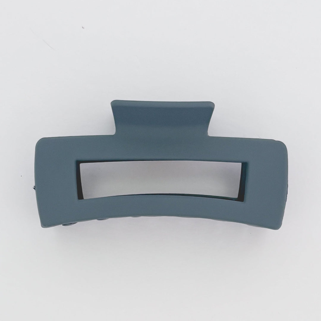 Gray hair clip on a white background