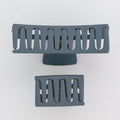 Two gray metal grates on a white background