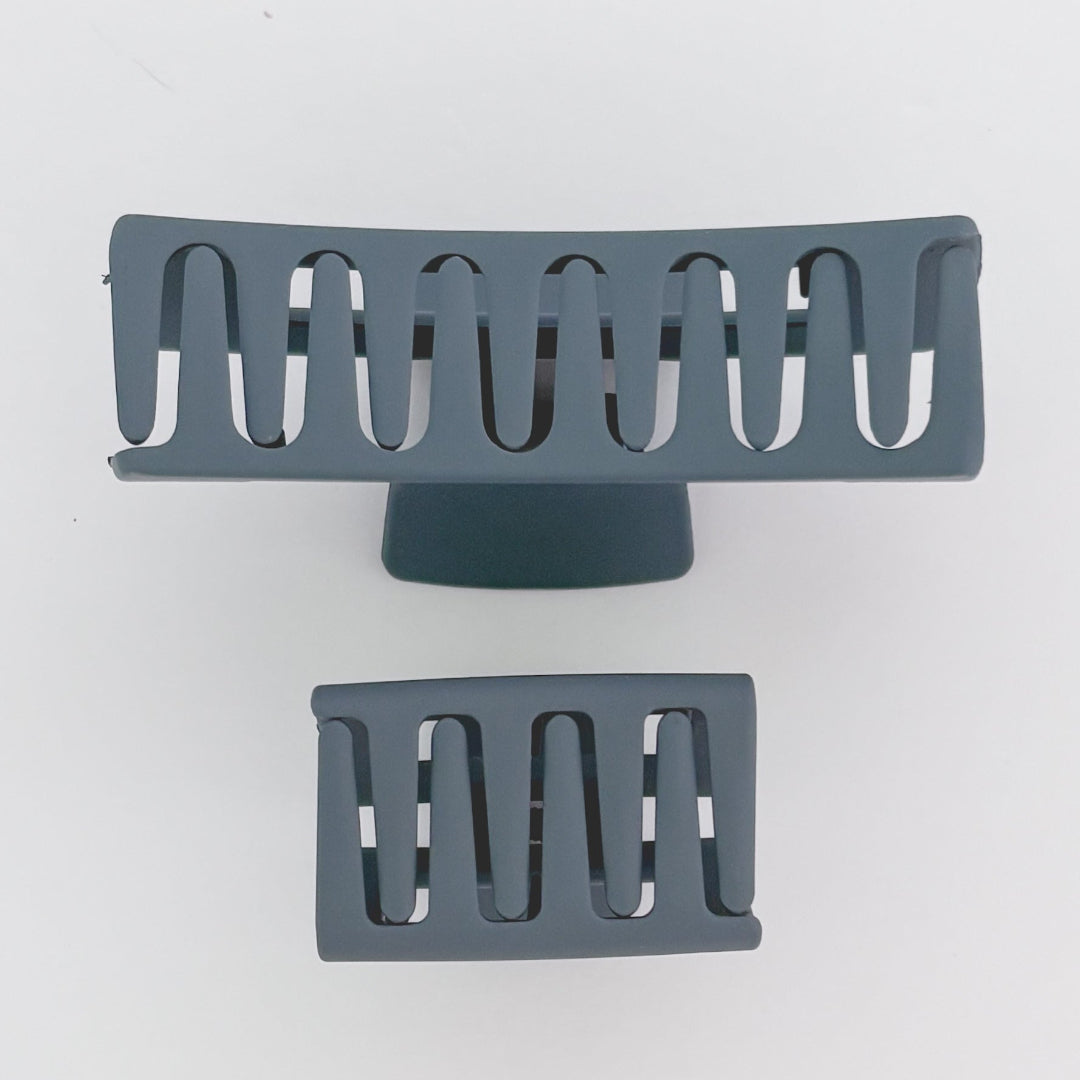 Two gray metal grates on a white background