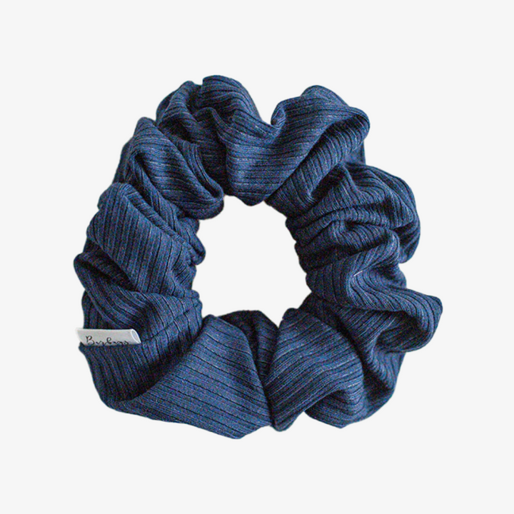 A dark blue ribbed scrunchie.