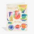 Colorful card with watercolor teacups and text on a white background