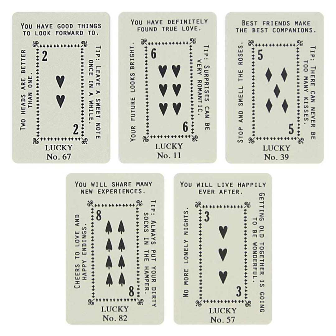 Set of five playing cards with text and symbols on a white background