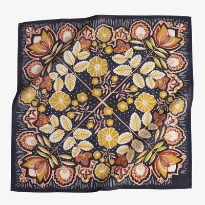 A navy blue bandana with a floral pattern. The pattern features stylized flowers, leaves, and berries in shades of yellow, orange, and pink.