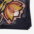 A navy blue bandana with a floral pattern. The pattern features stylized flowers, leaves, and berries in shades of yellow, orange, and pink.