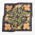 A black bandana with a floral pattern. The pattern features orange flowers and green leaves on a black background.