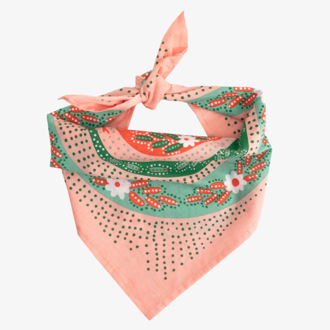 Decorative bandana with floral and polka dot patterns on a white background