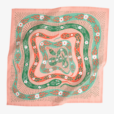 Decorative bandana with snake and floral pattern on a pink background