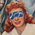 A blue sleep mask with an octopus pattern. The mask has an elastic band to fit around the head.
