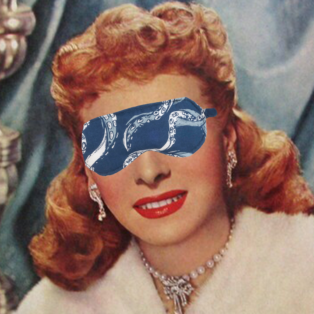 A blue sleep mask with an octopus pattern. The mask has an elastic band to fit around the head.