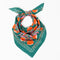 A green bandana with a floral pattern. The pattern features orange and pink flowers with green leaves. The border of the bandana has a decorative, repeating pattern.
