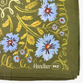 Handkerchief with floral design and 'Handker 143' branding on a green background