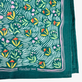 Handkerchief with floral pattern on a green background, featuring the brand 'Handker 144'.