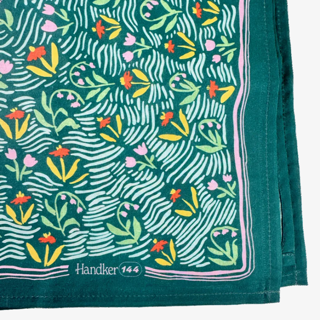 Handkerchief with floral pattern on a green background, featuring the brand 'Handker 144'.