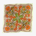 Floral patterned fabric with orange, green, and yellow flowers on a white background