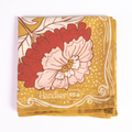Floral patterned handkerchief with 'Handler 154' branding on a yellow background