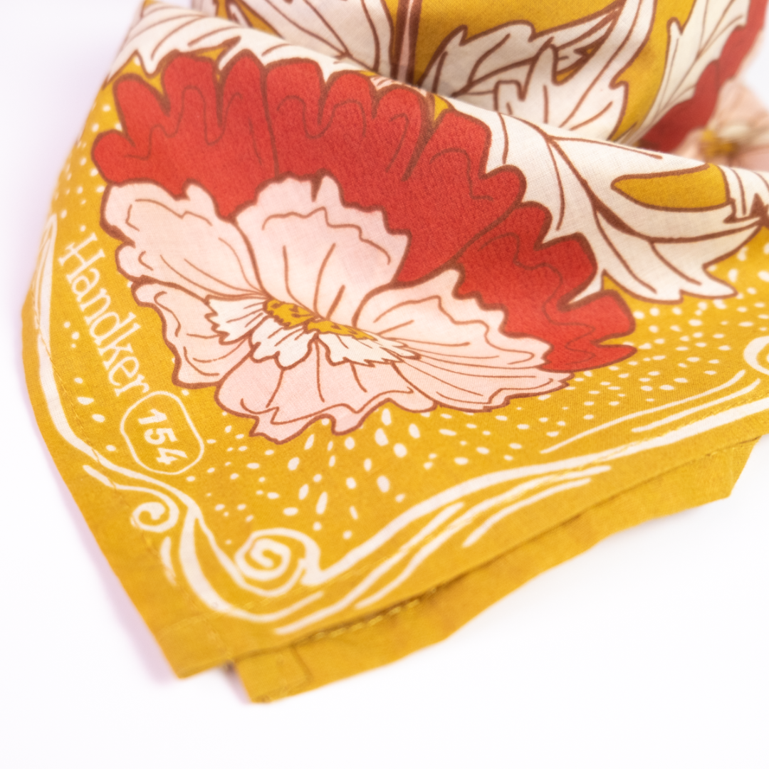Yellow bandana with floral design and 'Handkerchief 154' branding on a white background