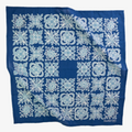 Blue bandana with white floral patterns on a white background
