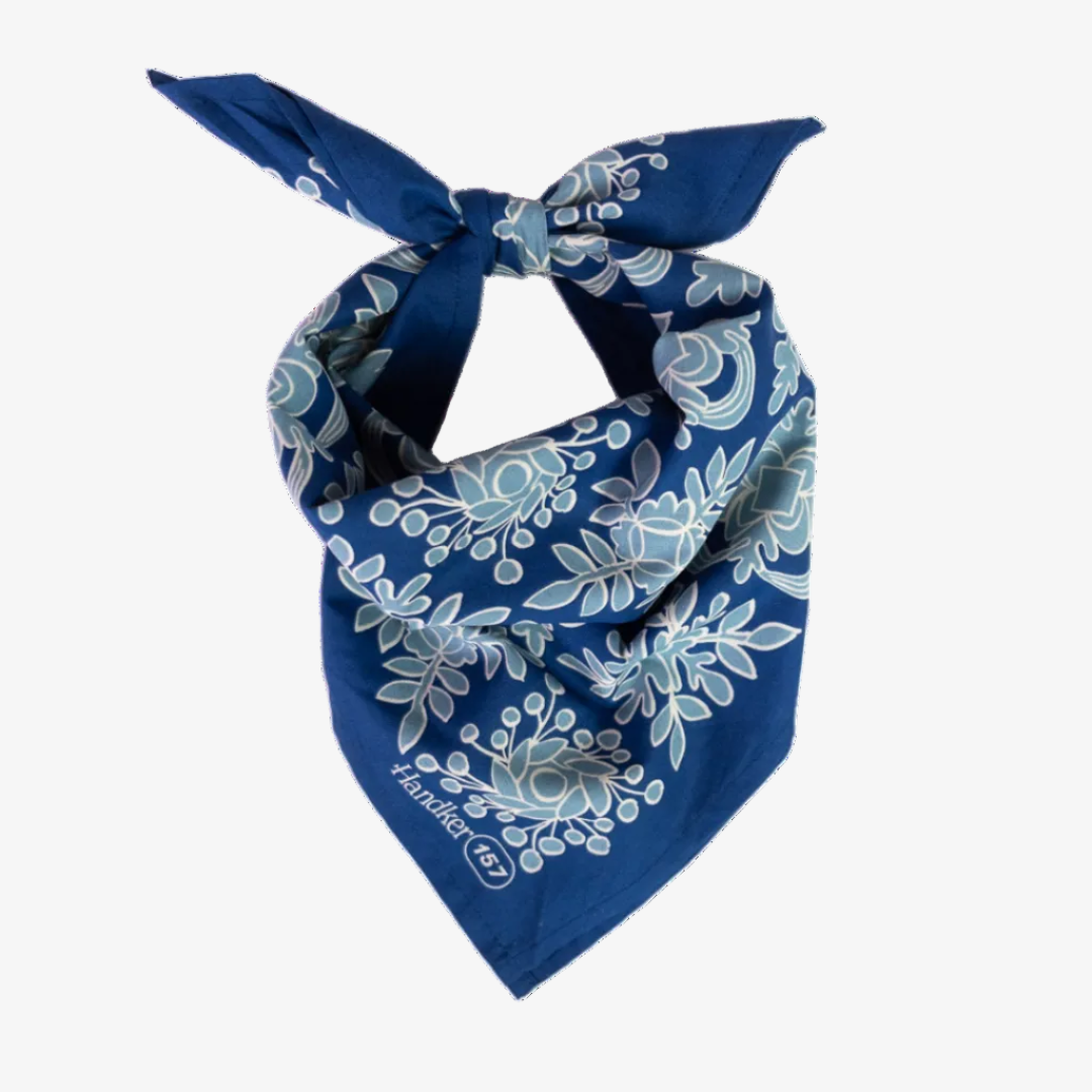 Blue bandana with white floral pattern on a white background