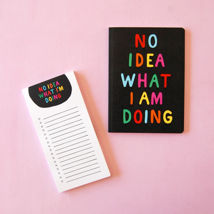 A black notebook with the text 