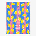 Towel with lemon pattern and text on blue and pink background