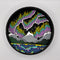 A Paint By Layers Craft Kit featuring a circular shadow box with a pre-designed landscape scene. The scene depicts a mountain range under a vibrant aurora borealis. The kit includes layers of wood, paint, and instructions. The title of the kit is 