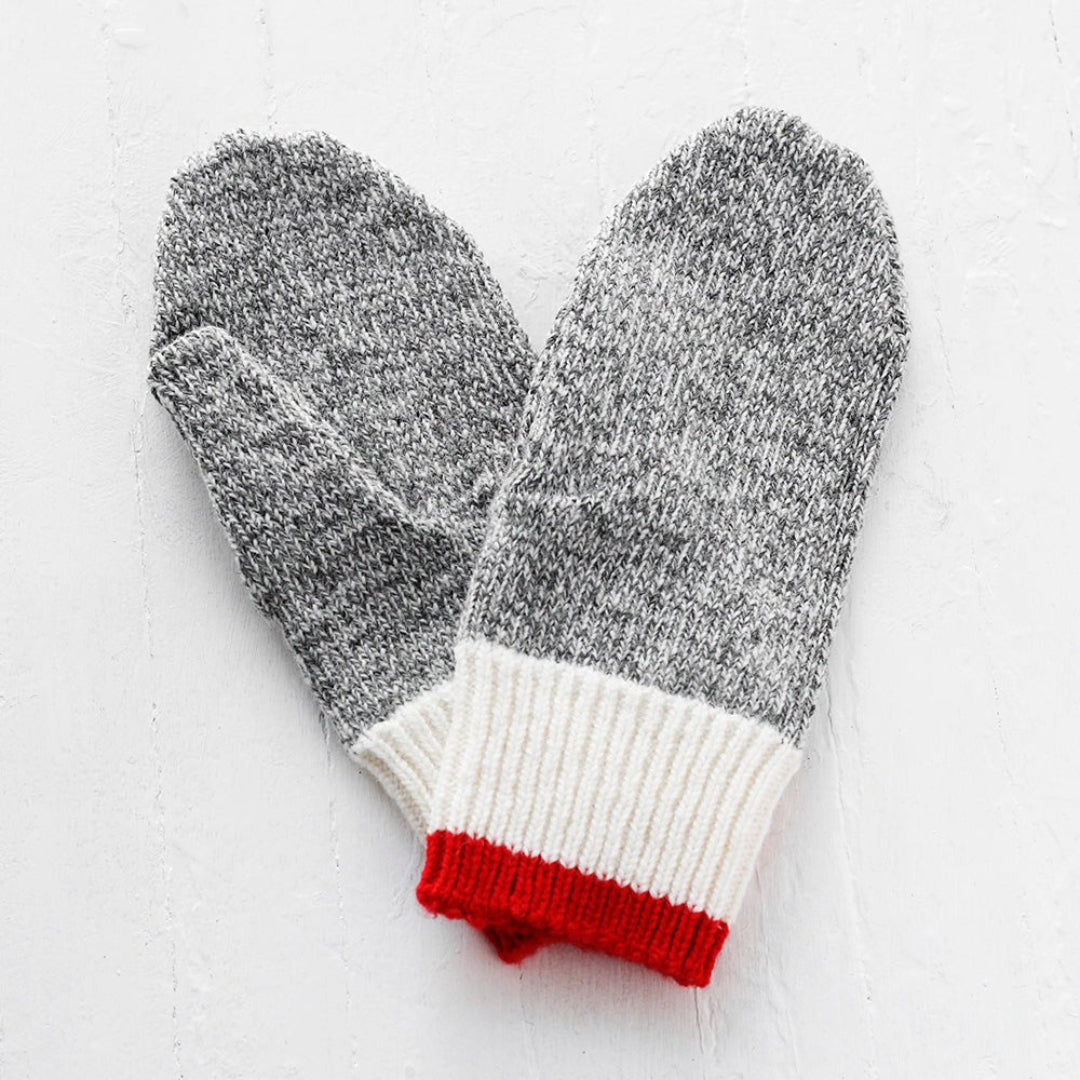 Pair of gray gloves with white cuffs and red accents on a light gray background