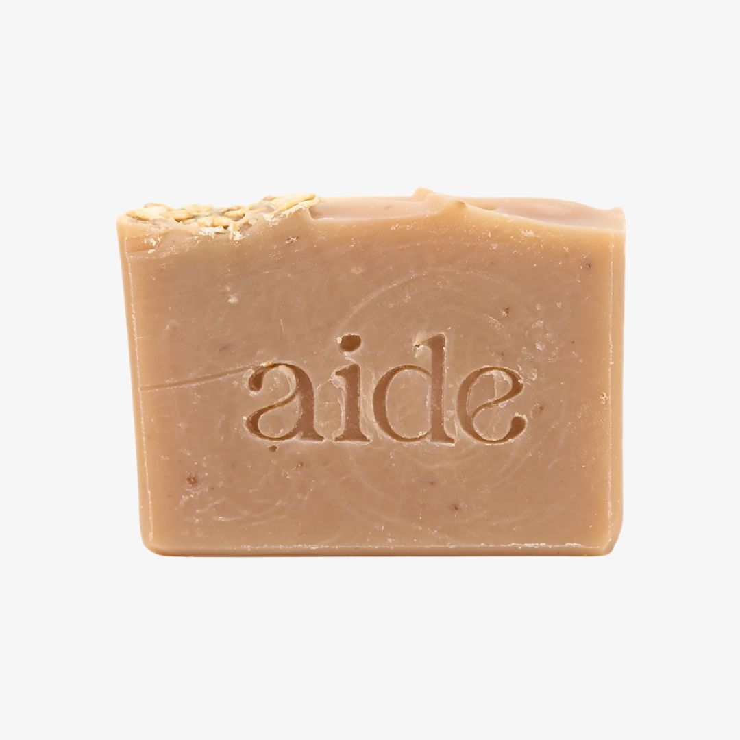 Bar of soap with 'aide' branding on a white background