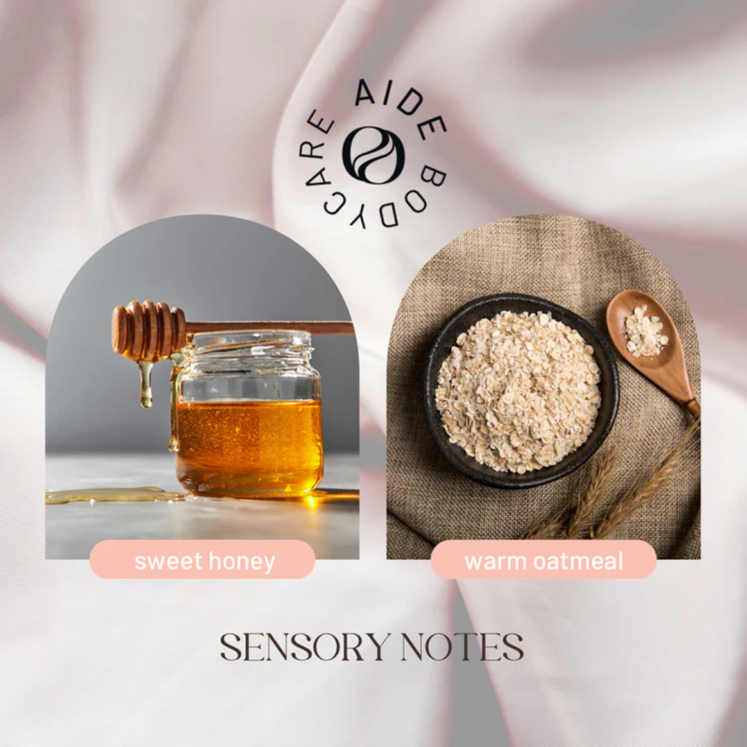 A bar of Aide Bodycare Oat & Honey Soap, featuring a light beige color and a paper label with the 'aide' logo and 'Oat & Honey' text, displayed on a light-colored surface. The soap is natural and handmade, available in Mississippi Mills, Ontario, Canada.