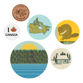 A clear plastic package containing six Canadian-themed pin-back buttons. The header card reads "The Regional Assembly of Text PACK OF BUTTONS" with a red shield containing "OH CANADA LOVED BY ALL" and "TO WEAR AND SHARE" below. Visible buttons include a maple leaf coin design, a globe with "I ♥ CANADA", and a cabin in a forest.