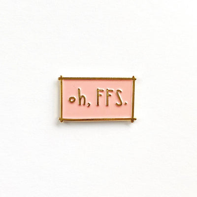 Enamel pin with 'oh, FFS.' text on a white background