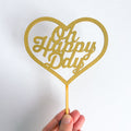 Gold heart-shaped 'Oh Happy Day' decoration on a white background