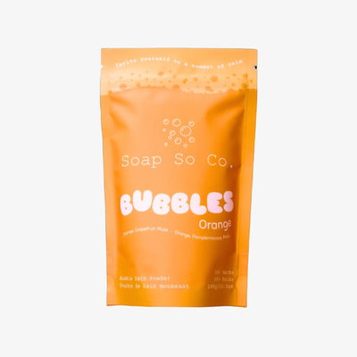 Orange package of Soap So Co. Bubbles Orange bath product on a black background