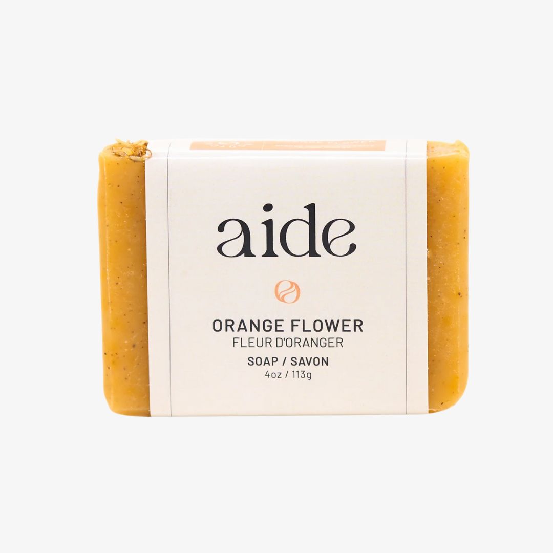 Bar of soap with 'aide' branding on a white background