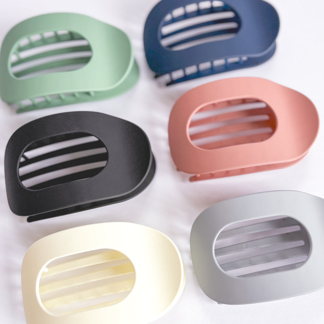 Set of colorful soap holders on a white background