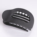 Black hair clip on a white background
