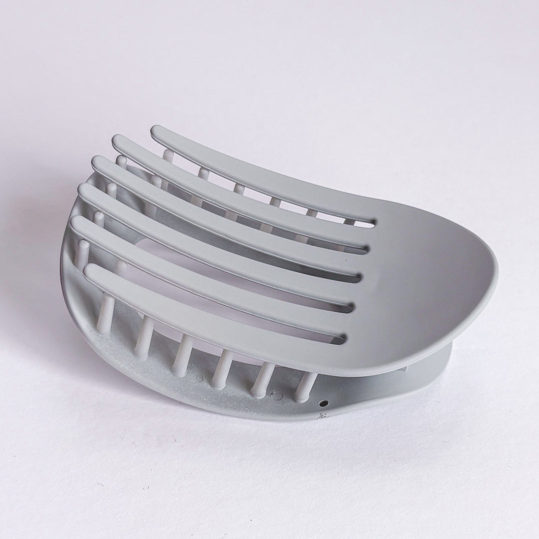 Gray metal soap dish on a white background